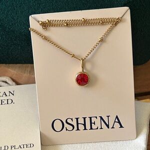 Oshena designer beachwear Gold Necklace with Red gemstone Pendant